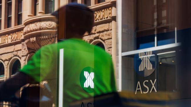 SYDNEY, AUSTRALIA - NewsWire Photos, October 29 2024. GENERIC. Stocks. Finance. Economy. A food delivery rider passes the Australian Stock Exchange, ASX, on Bridge Street. Picture: NewsWire / Max Mason-Hubers