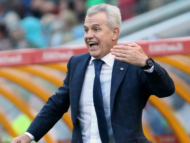 Japan coach Javier Aguirre gestures to his players during the AFC Asia Cup soccer match between Japan and Palestine in Newcastle, Australia, Monday, January 12, 2014. (AP Photo/Rob Griffith)