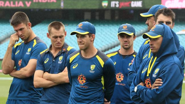 Tim Paine of Australia and team mates look on after India's 2-1 series win 