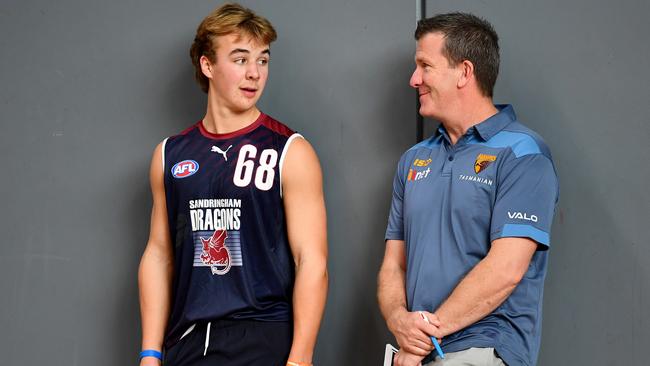 Ryley Sanders chats with with Hawthorn’s Player Acquisition Manager Mark Finnigan. Picture: Getty Images