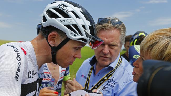 Britain's Chris Froome had his eyes treated for tear gas after farmers interrupted the race. (AP Photo/Peter Dejong)