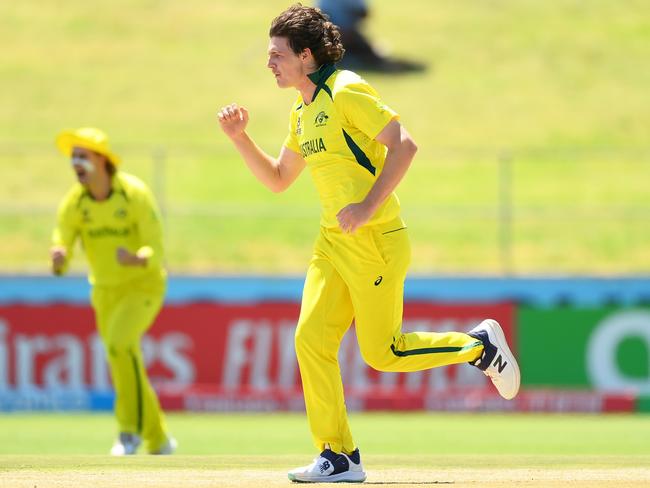 Tom Straker takes one of six wickets in the semi-final win over Pakistan. Photo by Alex Davidson-ICC/ICC via Getty Images