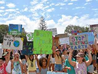 Young protesters at Peregian Beach made their message loud to stand up against climate change. Picture: Caitlin Zerafa