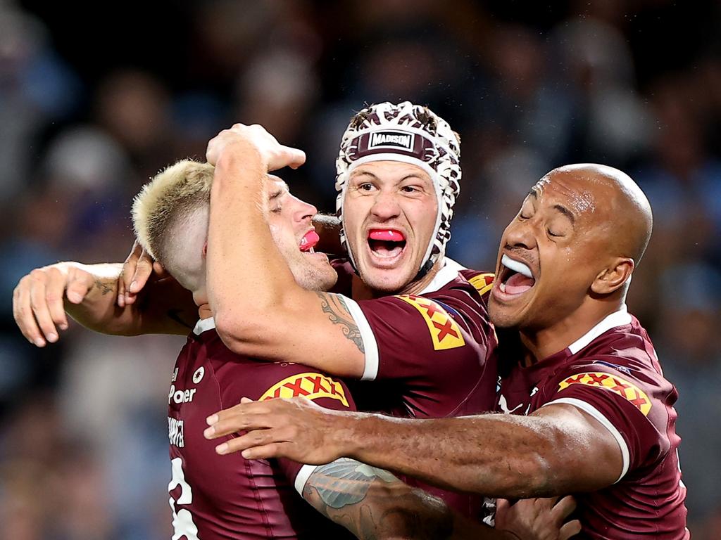 (L-R) Cameron Munster, Kalyn Ponga and Felise Kaufusi of the Maroons celebrate victory at full-time during game one of the 2022 State of Origin series. Picture: Getty Images