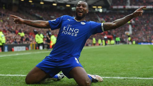 Leicester City’s Wes Morgan celebrates scoring his team's opening goal during the Barclays Premier League match between Manchester United and Leicester City at Old Trafford.