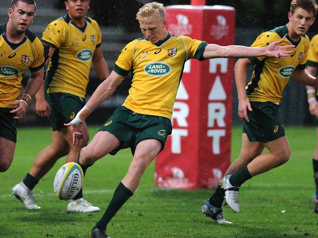 Carter Gordon looking to kick for touch while representing the Australian Schoolboys against NZ Schools at Ballymore. Picture: John Gass