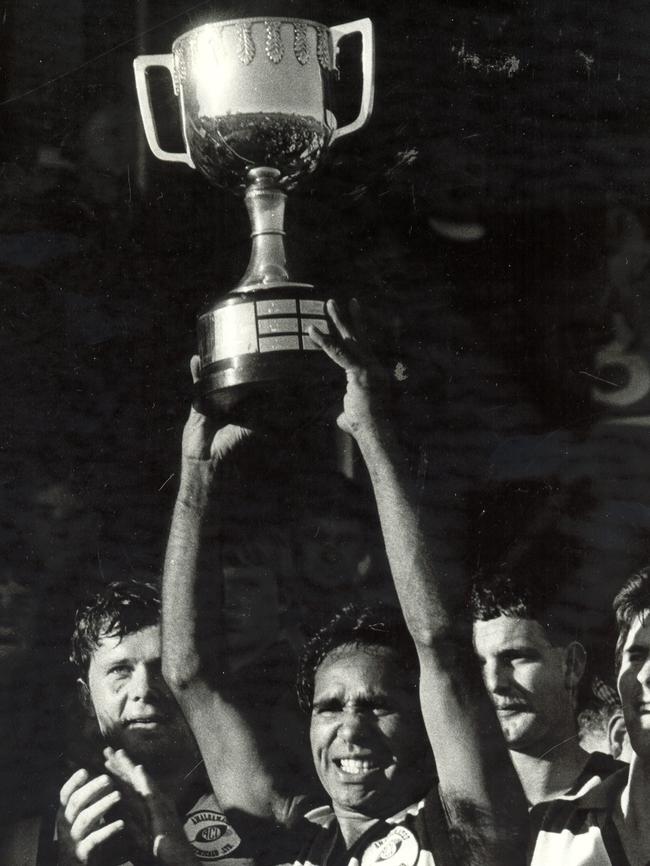 Mooroopna’s Gary Cooper with the GV premiership cup in 1985.