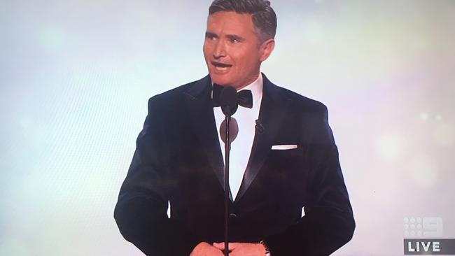 Hughes skewers Karl Stefanovic and Grant Hackett during his Logies monologue.