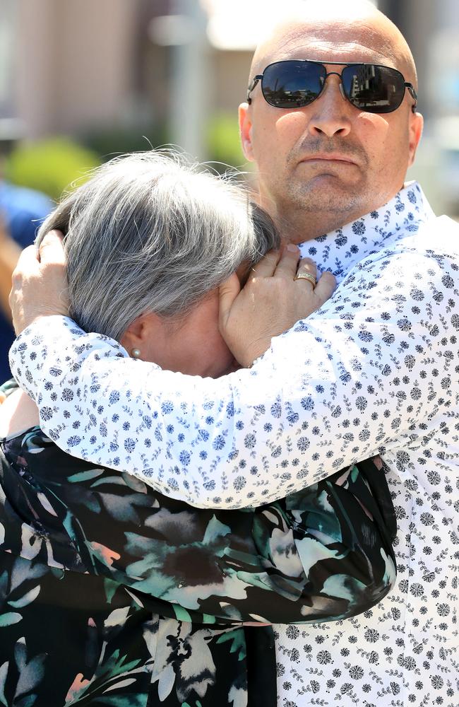 Donna and Miguel Baluskas console each other outside court after the verdict. Picture: Adam Head.