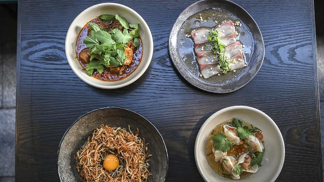 Clockwise from top left: Lamb curry, kingfish sashimi, Tom yum dumplings and black garlic mie goreng at LilyMu. Picture: Monique Harmer