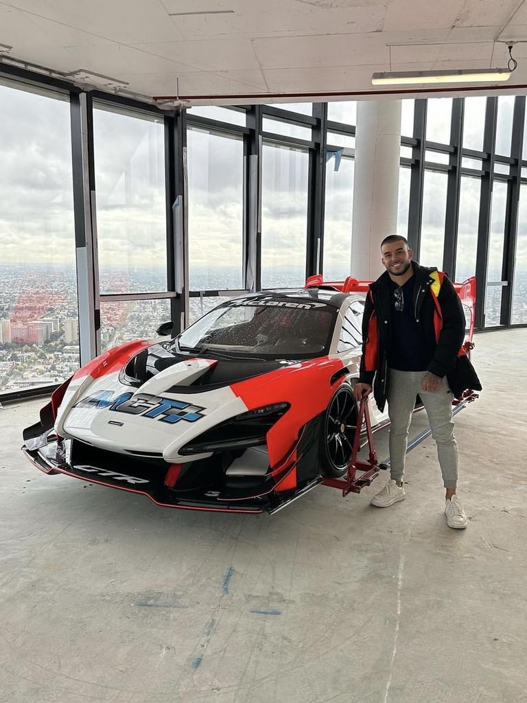 Adrian Portelli with his $3m McLaren after it was craned into his Melbourne penthouse. Image supplied.