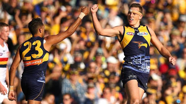 Lewis Jetta and Drew Petrie celebrate a West Coast goal.