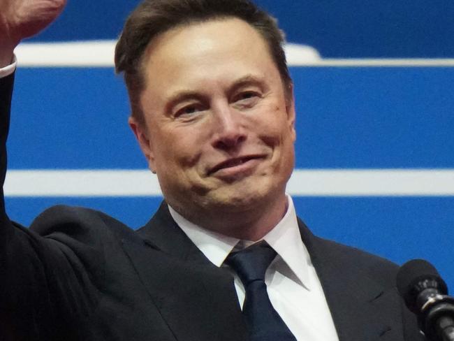 WASHINGTON, DC - JANUARY 20: Tesla, SpaceX and X CEO Elon Musk gestures while speaking during an inauguration event at Capital One Arena on January 20, 2025 in Washington, DC. Donald Trump takes office for his second term as the 47th president of the United States.   Christopher Furlong/Getty Images/AFP (Photo by Christopher Furlong / GETTY IMAGES NORTH AMERICA / Getty Images via AFP)