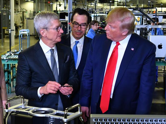 US President Donald Trump and Apple CEO Tim Cook, with Treasury Secretary Steven Mnuchin, tour the Flextronics computer manufacturing facility where Apple's Mac Pros are assembled in Austin, Texas in 2019. Picture: AFP