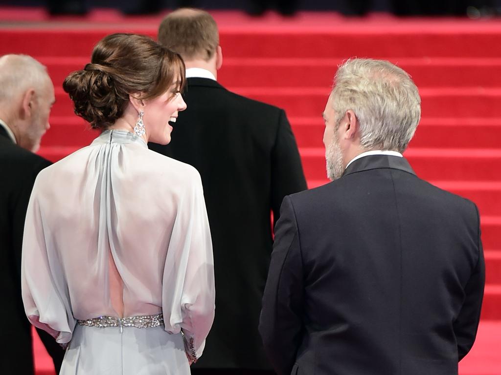 Britain’s Catherine, Duchess of Cambridge talks with British director Sam Mendes on arrival for the world premiere of the new James Bond film ‘Spectre.’ Picture: AFP