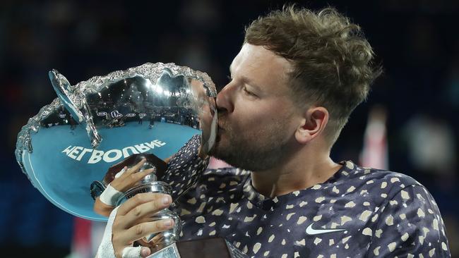 Australian Open Day 13. 01/02/2020. Mens wheelchair final. Dylan Alcott vs Andy Lapthorne on Rod Laver Arena. Australian Dylan Alcott kisses the winners trophy. Pic: Michael Klein