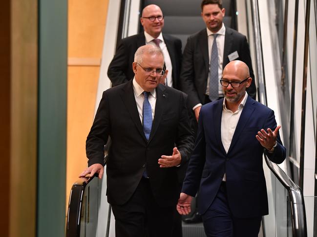 Prime Minister Scott Morrison (left) and President of the Business Council Tim Reed arrive at the Business Council of Australia (BCA) dinner at the Fullerton Hotel, in Sydney, Monday, April 19, 2021. (AAP Image/Joel Carrett) NO ARCHIVING, EDITORIAL USE ONLY