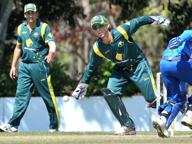 Australian Under 19 wicket keeper Ben McDermott reaches for the ball against India at Marrara in 2013. Picture: Justin Sanson.