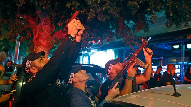 Security forces take aim at the scene of a shooting attack in Dizengoff Street in the centre of Israel's Mediterranean coastal city of Tel Aviv on April 7.