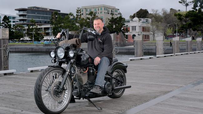 An ex bikie, Troy Koerntjes is organising a motorcycle ride from Geelong waterfront to Ocean Grove. Troy Koerntjes with his Harley-Davidson custom softail. Picture: Mark Wilson