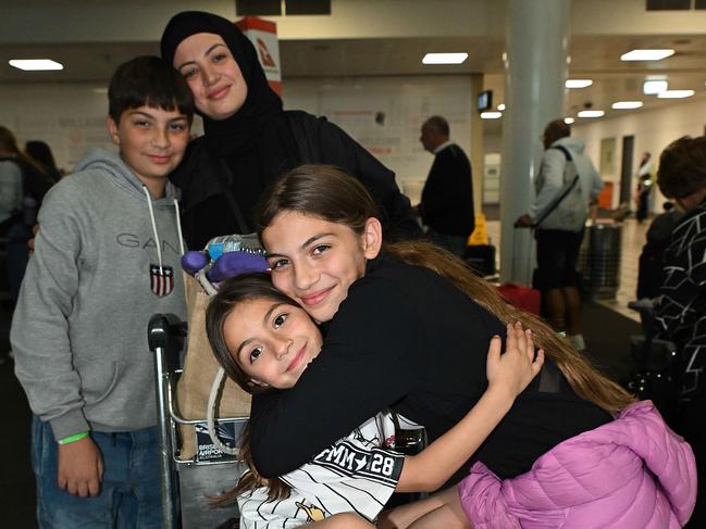 9/10/2024: Racha Ismal with her children Leila 5, Rayann 10 and Yusef 10 after arriving back on an Emergency evacuation charter flight passengers from Lebanon, via Cyprus, arrive at Brisbane International Airport. pic: Lyndon Mechielsen/Courier Mail