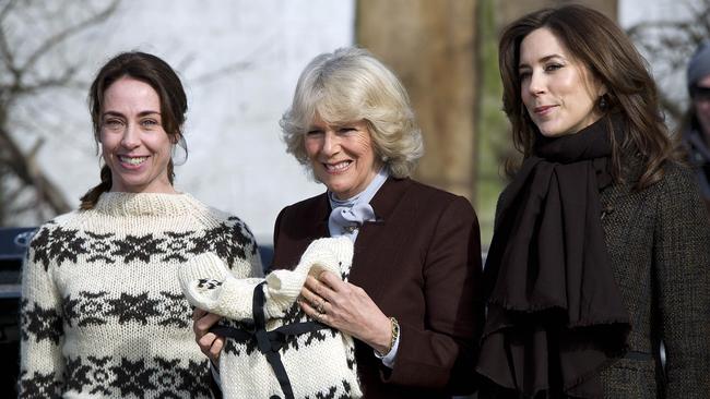 Grabol presents Camilla with a replica of her infamous sweater in 2012 during a visit to the film set of The Killing with now Queen Mary of Denmark. Picture: AFP