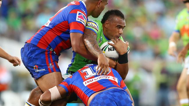 Junior Paulo of the Raiders is tackled.