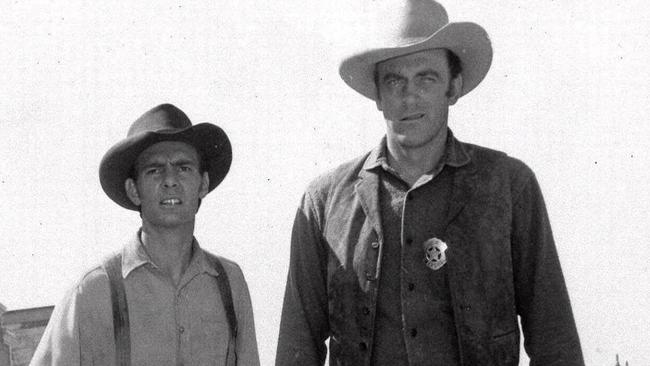 Dennis Weaver, left, as the slow-witted deputy Chester and James Arness as Marshall Matt Dillon in Gunsmoke, 1956.