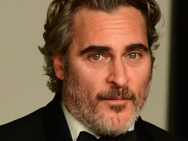 US actor Joaquin Phoenix poses in the press room with the Oscar for Best Actor for "Joker" during the 92nd Oscars at the Dolby Theater in Hollywood, California on February 9, 2020. (Photo by FREDERIC J. BROWN / AFP)