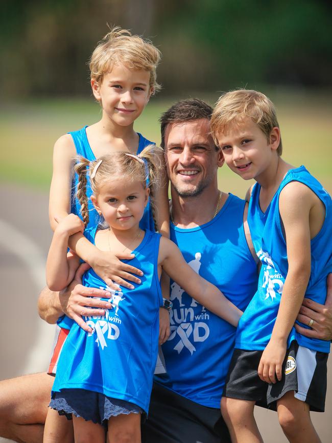 Running Dad Joshua Tidswell and his fit kids Oliver 8, Arielle 3 and Sebastian 6 ready to ‘Run With Dad’ next weekend. Picture GLENN CAMPBELL
