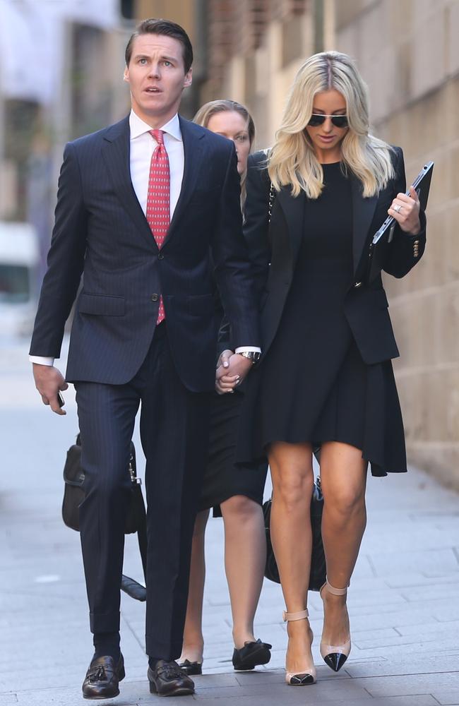 Oliver Curtis and wife Roxy Jacenko arrive at court this morning ahead of the verdict. Curtis was today found guilty. Picture: John Grainger