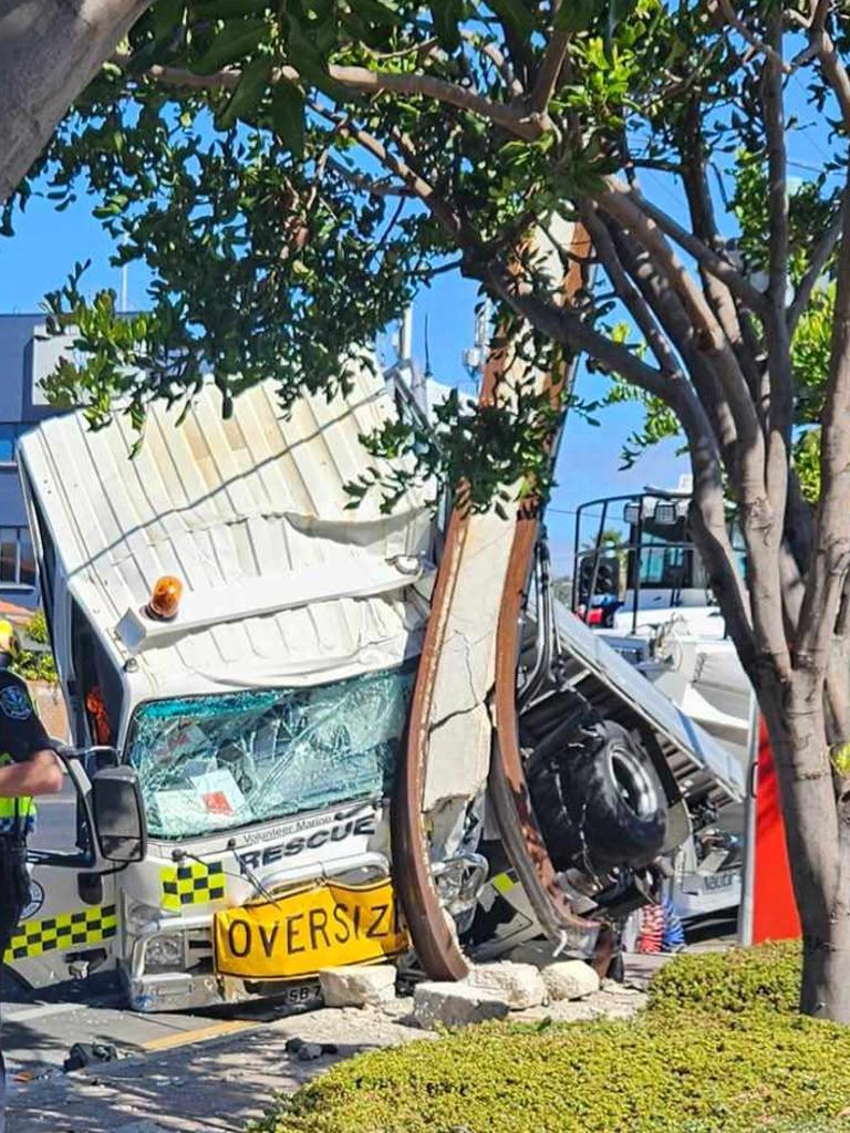 A truck from the SA Sea Rescue Squadron has crashed on Brighton road, with a rescue boat attached to the back.