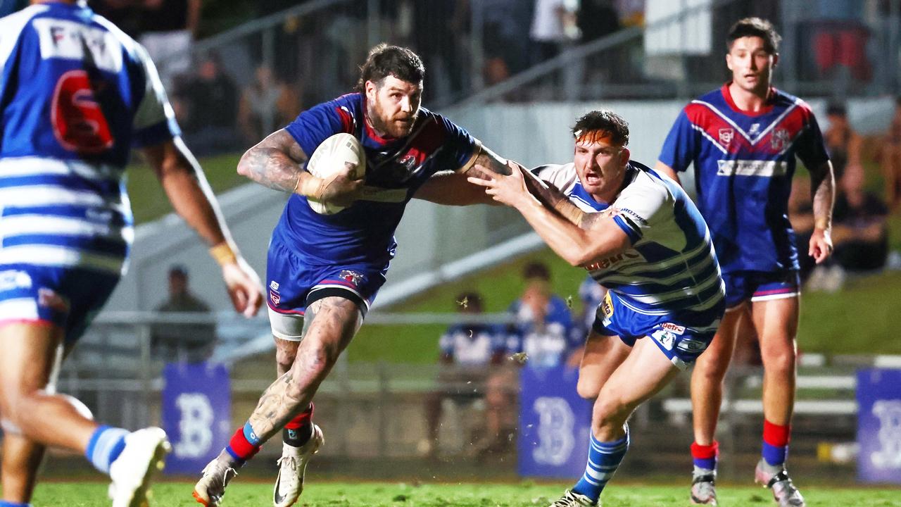 Knights captain Josh Dugan is caught by Brothers' Sam Cramp in the FNQRL A grade grand final match between the Ivanhoe Knights and the Cairns Brothers, held at Barlow Park. Picture: Brendan Radke