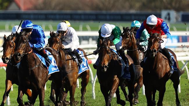 Ameena and James McDonald (red, blue sleeves) beats Silmarillion (blue) and Manaal (green, white cap) in the Group 2 Silver Shadow Stakes at Randwick. Picture: Getty Images