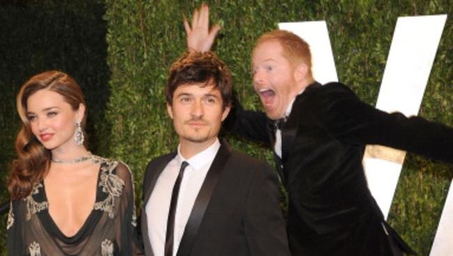 Best Oscar Photobombs: Miranda Kerr, Orlando Bloom and Jesse Tyler Ferguson attend the 2013 Vanity Fair Oscar party at Sunset Tower on February 24, 2013 in West Hollywood, California. (Photo by Jon Kopaloff/FilmMagic)