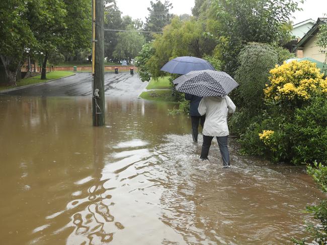 Residents of North st Windsor Are forced to wade Through sewage mixed with flooding .picture John Grainger