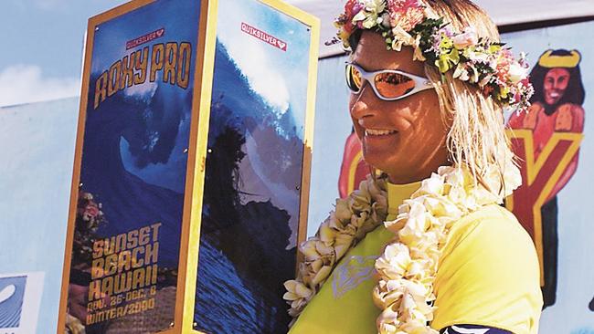 Beachley with her trophy for the Quiksilver Roxy Pro title at Sunset Beach, Oahu, in 2000.