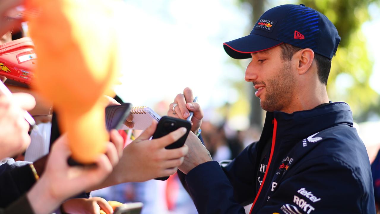 Daniel Ricciardo mobbed by fans. Photo by Quinn Rooney/Getty Images.