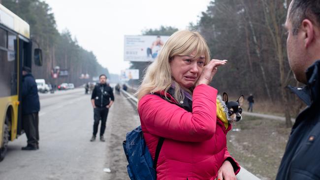 A wife bids goodbye on Sunday to her husband as he remains behind in Irpin to fight the Russians. Picture: Getty Images