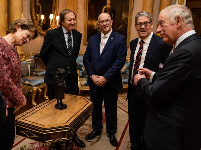 Britain's King Charles III (R) reacts as he is presented with a maquette of his late mother, Queen Elizabeth II, by Governor of South Australia Frances Adamson, Former Agent General of South Australia, Bill Muirhead, serving agent General of South Australia, David Ridgway and Peter Flavel, during an audience at Buckingham Palace, in London on November 24, 2022. Picture: Aaron Chown / POOL / AFP