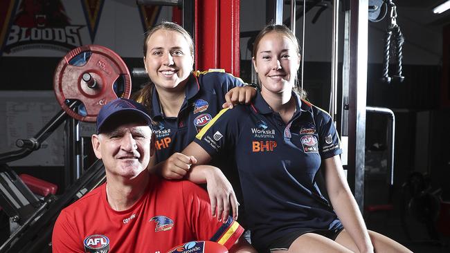 Former Crows player and West Adelaide coach Mark Mickan back with the Crows as AFLW ruck coach – with former West Adelaide youngsters and Crows players Chelsea Biddell and Madison Newman at the Westies clubrooms. Picture: Sarah Reed.