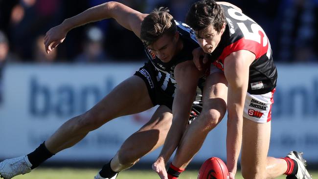 AFL draft prospect Chris Burgess fights for the ball with Port’s Dougal Howard. Picture: Calum Robertson