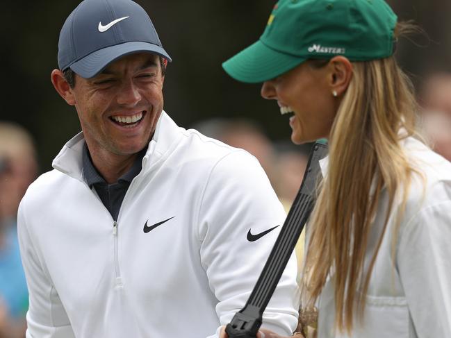 AUGUSTA, GA - APRIL 04:  Rory McIlroy of Northern Ireland laughs with his wife Erica during the Par 3 Contest prior to the start of the 2018 Masters Tournament at Augusta National Golf Club on April 4, 2018 in Augusta, Georgia.  (Photo by Patrick Smith/Getty Images)