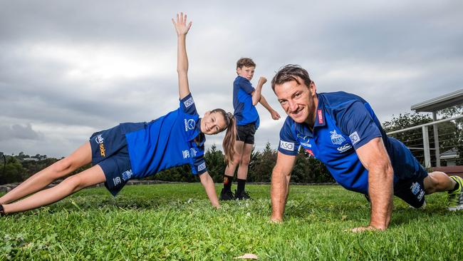 Brent ‘Boomer’ Harvey and his kids Lacie, 13 and Hudson, 8 are starting up a free online fitness service. Picture: Jake Nowakowski