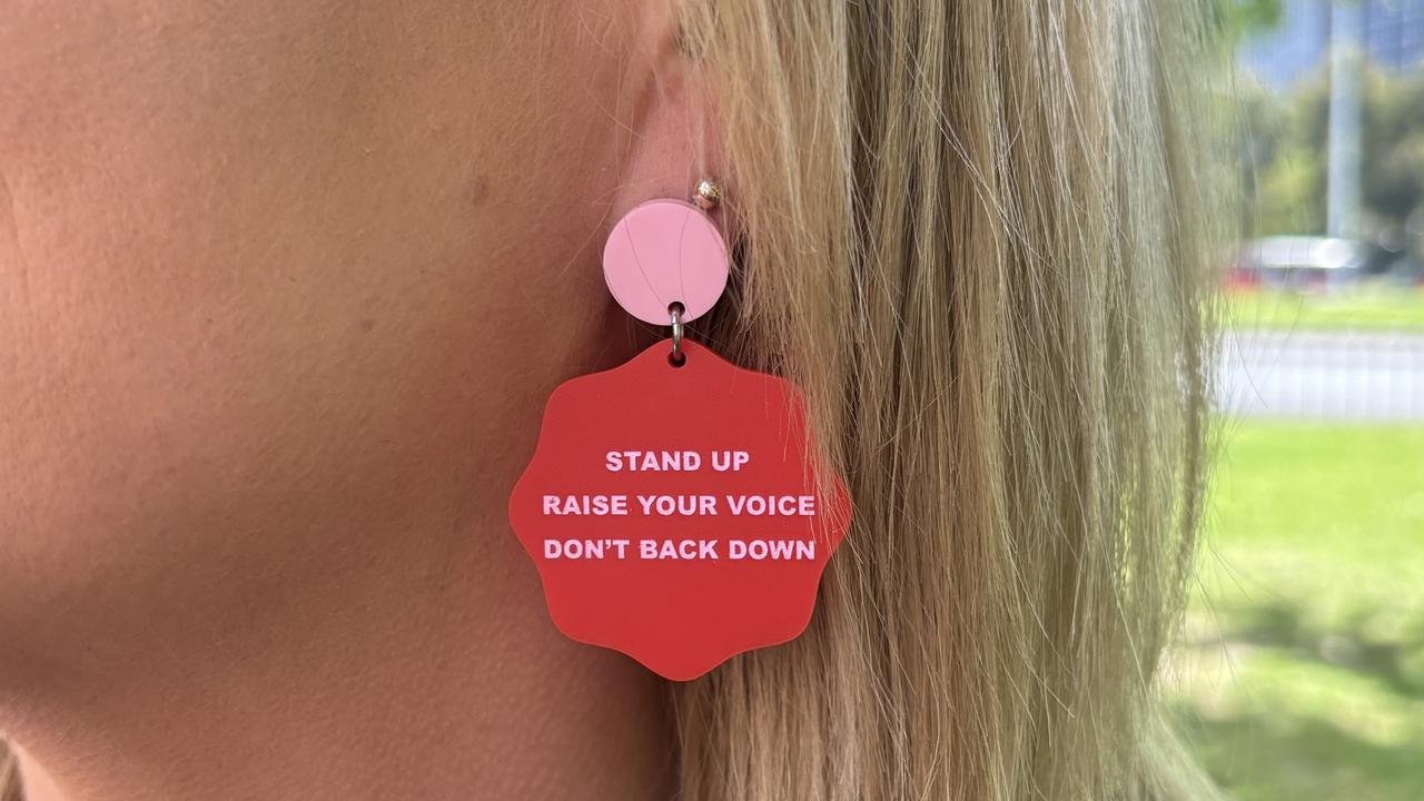 The women wore matching earrings as a sign of unity.