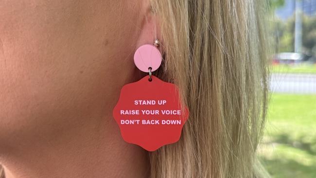 The women wore matching earrings as a sign of unity.