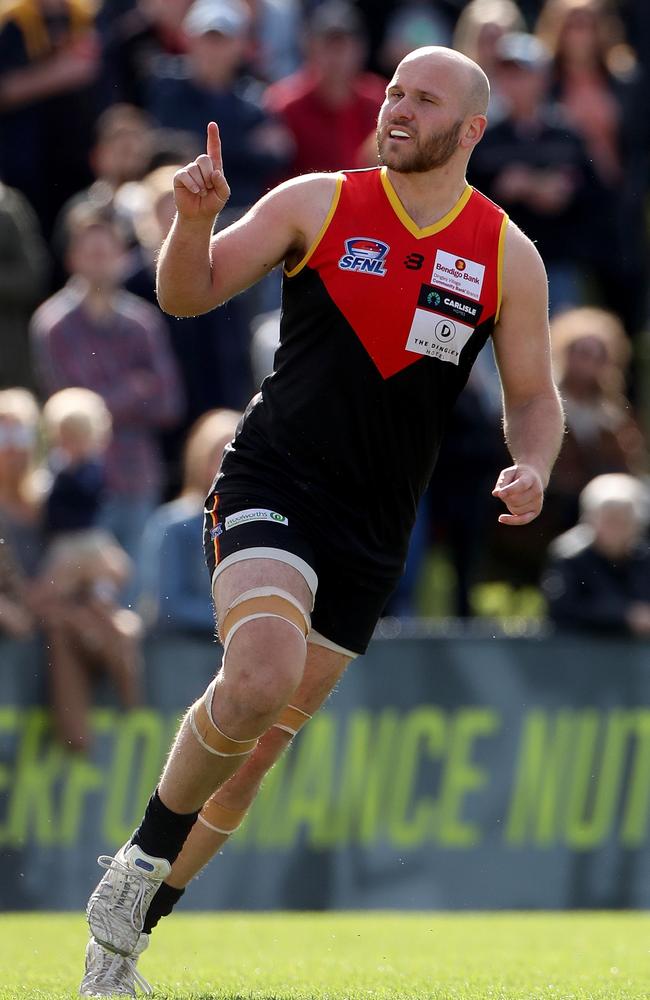 Daniel Farmer celebrates a goal for Dingley.