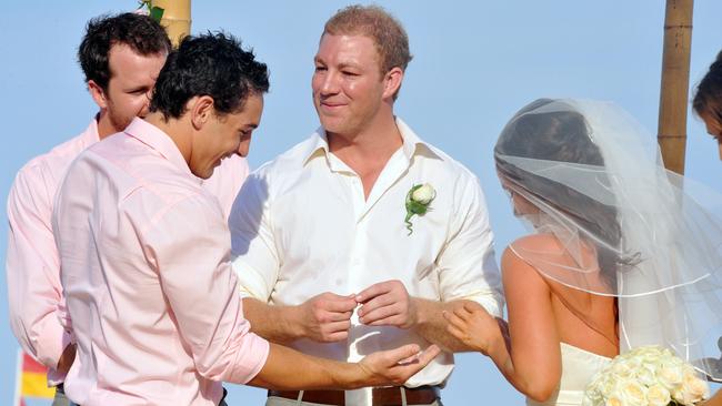 Melbourne Storm and Queensland Rugby League player Michael Crocker and Sally Carne marry on the sands of Sunshine Beach. Pictured with groomsman Billy Slater. Picture: Warren Lynam