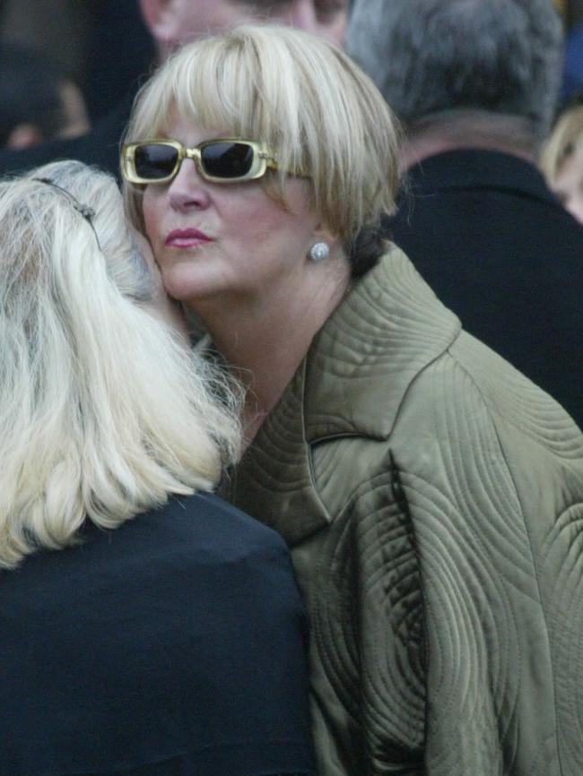 Mourners comfort Judy Moran at Jason’s funeral.