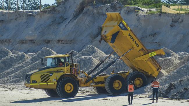 Workers begin the sand delivery process. Picture: Roy VanDerVegt